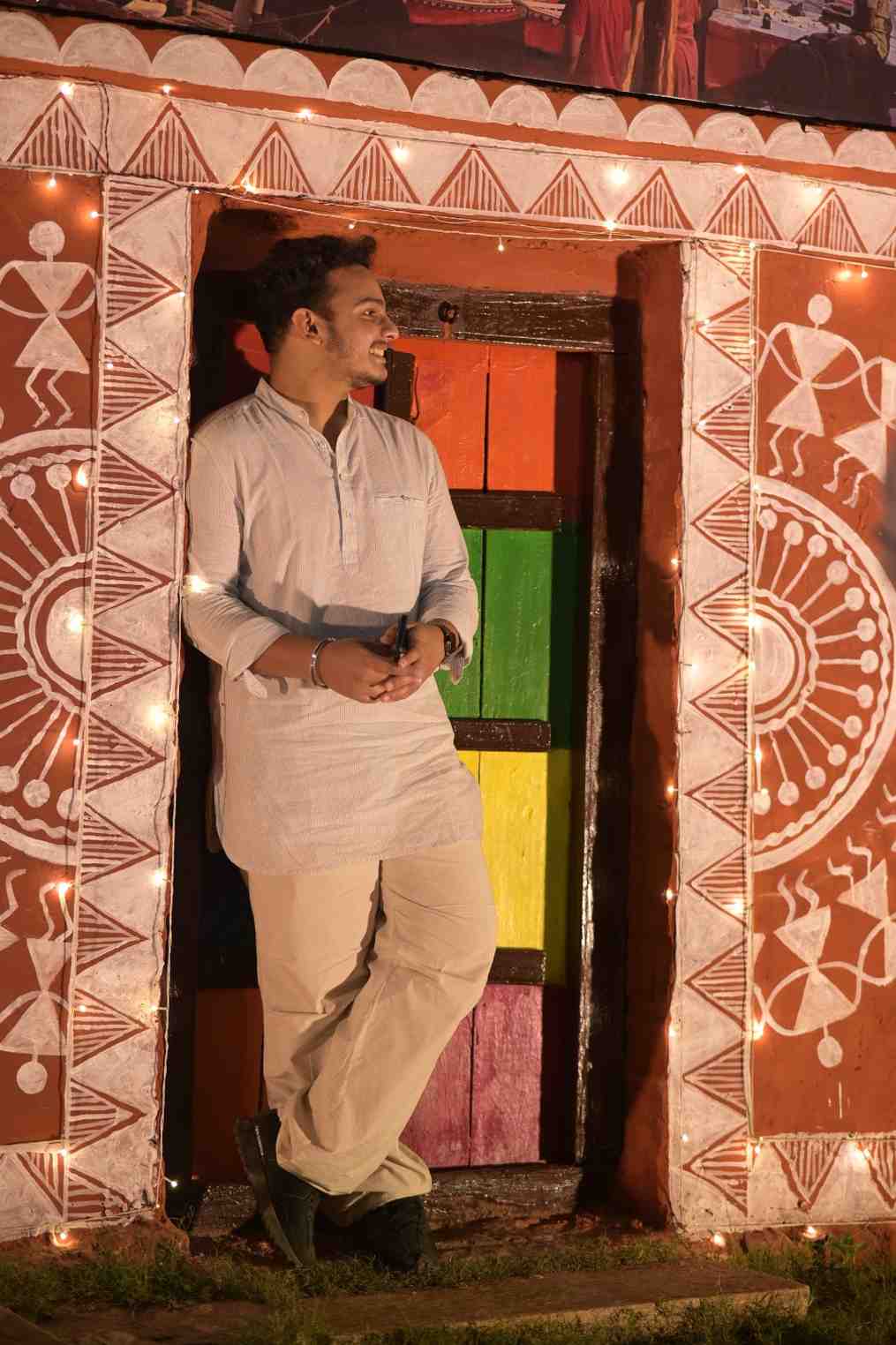 A smiling couple enjoying the festivities at night.